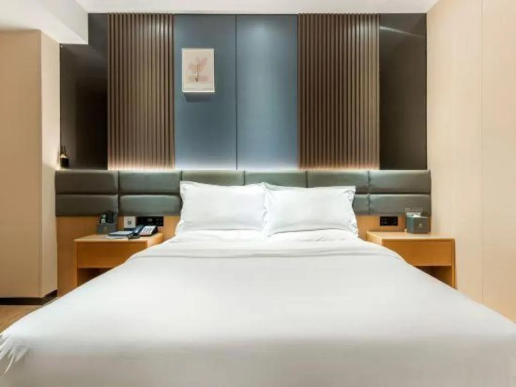 Bed in Chonpines Hotel Guangzhou Sunac Cultural and Tourism City Shiling