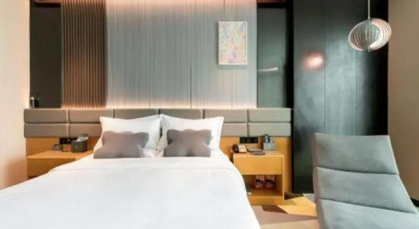 Bed in Chonpines Hotel Guangzhou Sunac Cultural and Tourism City Shiling