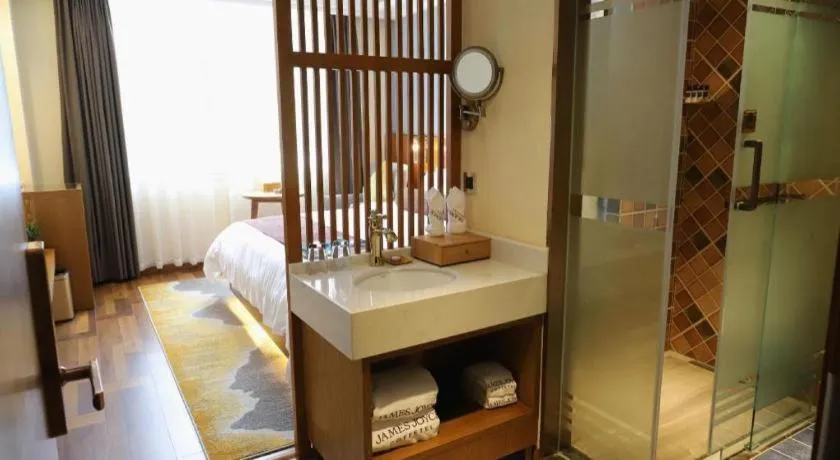 Bed in James Joyce Coffetel Guangyuan High-Speed Railway Station Dongba Municipal Government