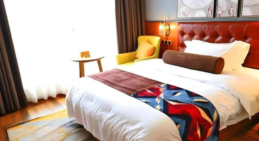 Bed in James Joyce Coffetel Guangyuan High-Speed Railway Station Dongba Municipal Government