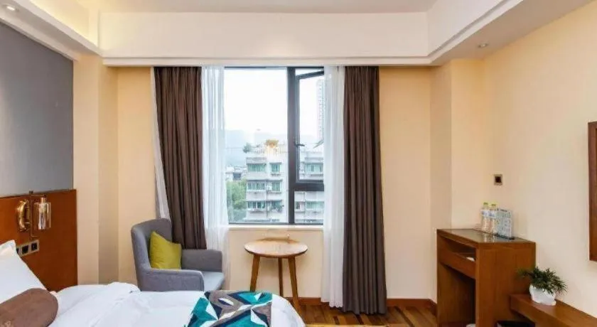 Bed in James Joyce Coffetel Guangyuan High-Speed Railway Station Dongba Municipal Government