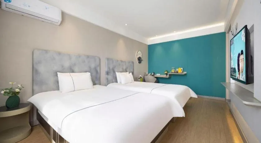 Bed in Magnotel Hotel Dandong Railway Yalv River