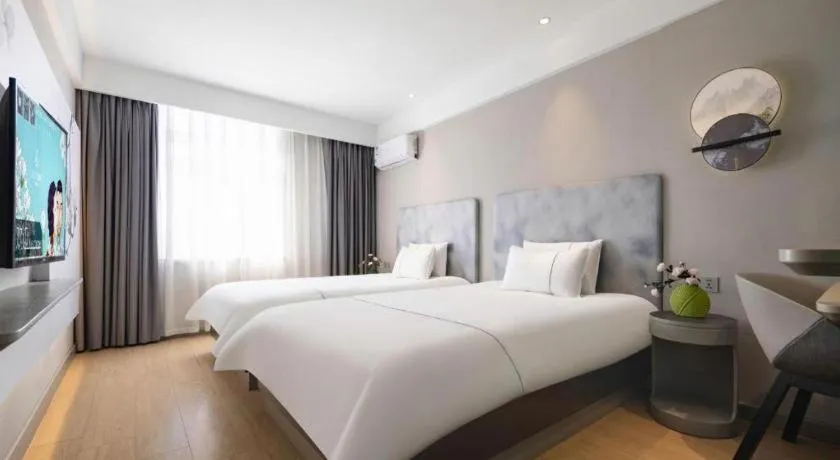 Bed in Magnotel Hotel Dandong Railway Yalv River