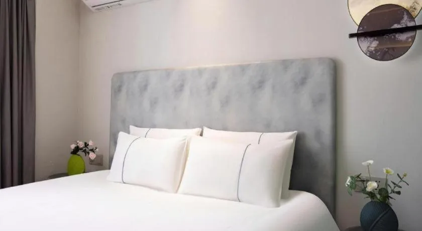 Bed in Magnotel Hotel Dandong Railway Yalv River