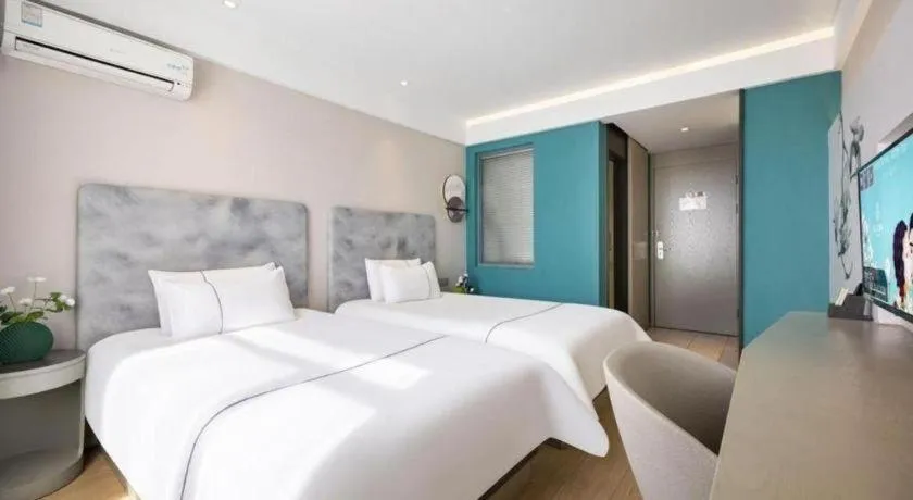 Bed in Magnotel Hotel Dandong Railway Yalv River