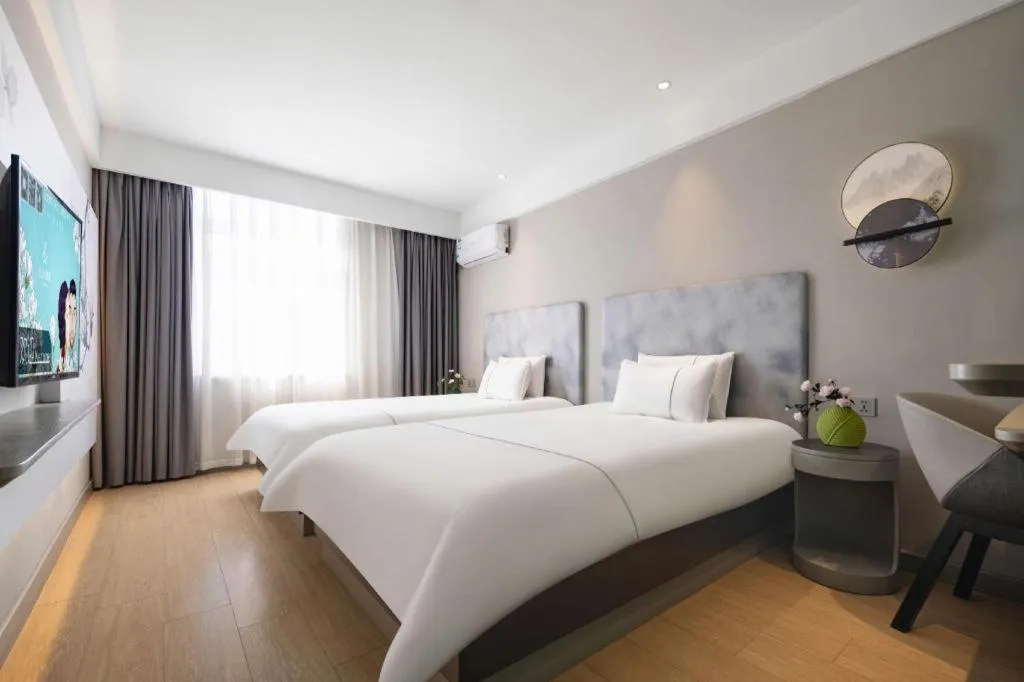 Bed in Magnotel Hotel Dandong Railway Yalv River