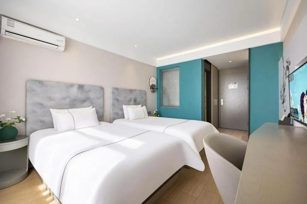 Bed in Magnotel Hotel Dandong Railway Yalv River