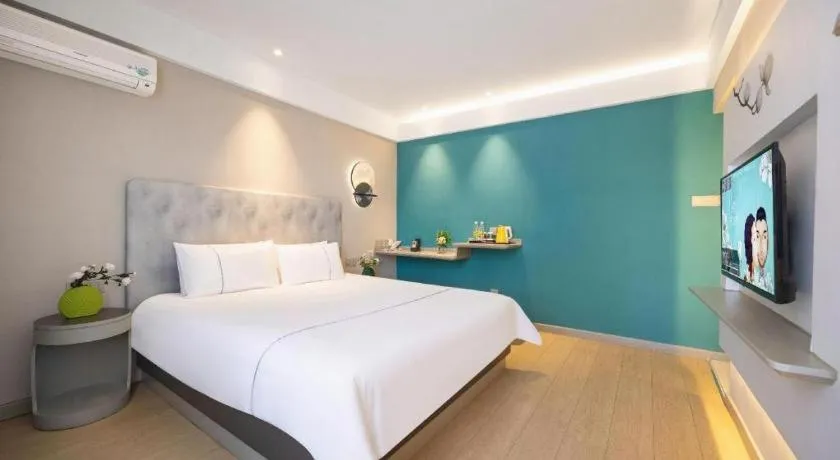 Bed in Magnotel Hotel Dandong Railway Yalv River