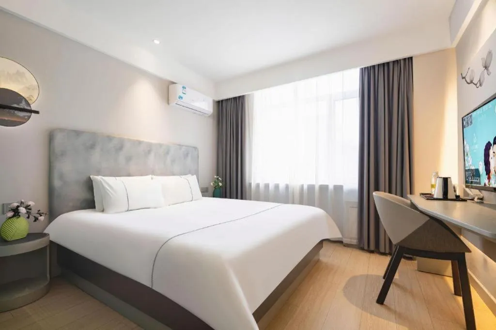 Bed in Magnotel Hotel Dandong Railway Yalv River