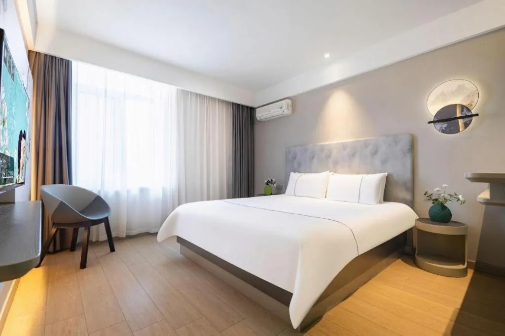 Bed in Magnotel Hotel Dandong Railway Yalv River