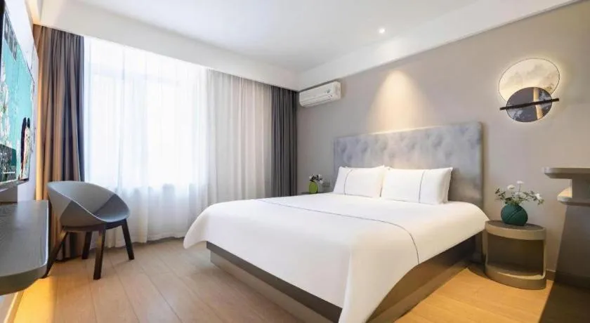 Bed in Magnotel Hotel Dandong Railway Yalv River