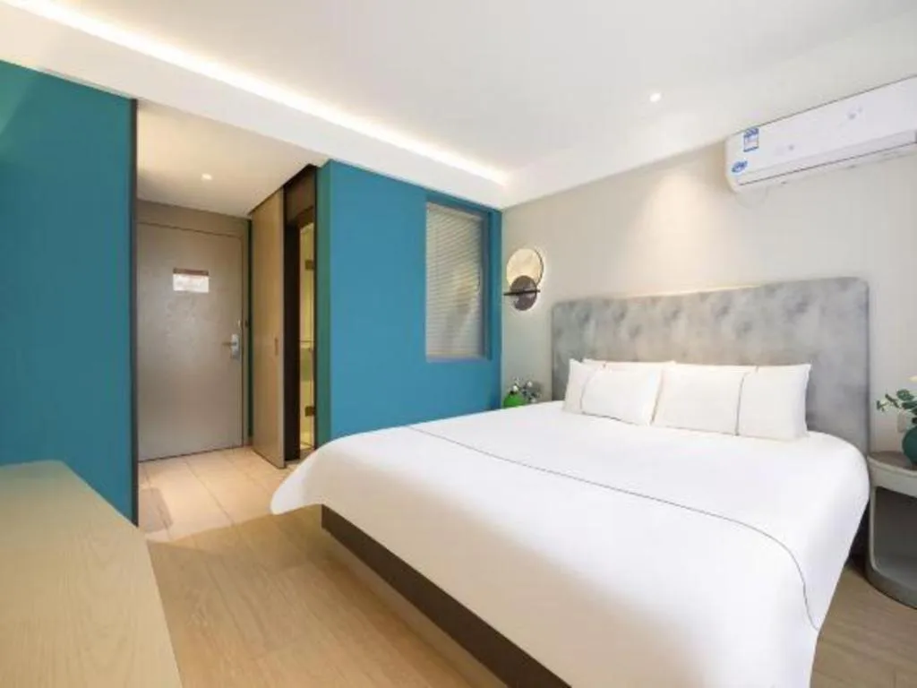 Bed in Magnotel Hotel Dandong Railway Yalv River