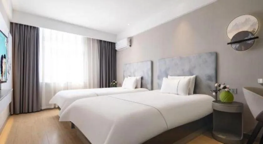 Bed in Magnotel Hotel Dandong Railway Yalv River