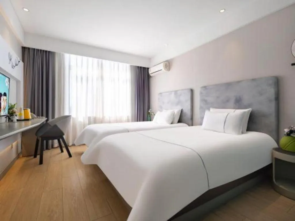 Bed in Magnotel Hotel Dandong Railway Yalv River