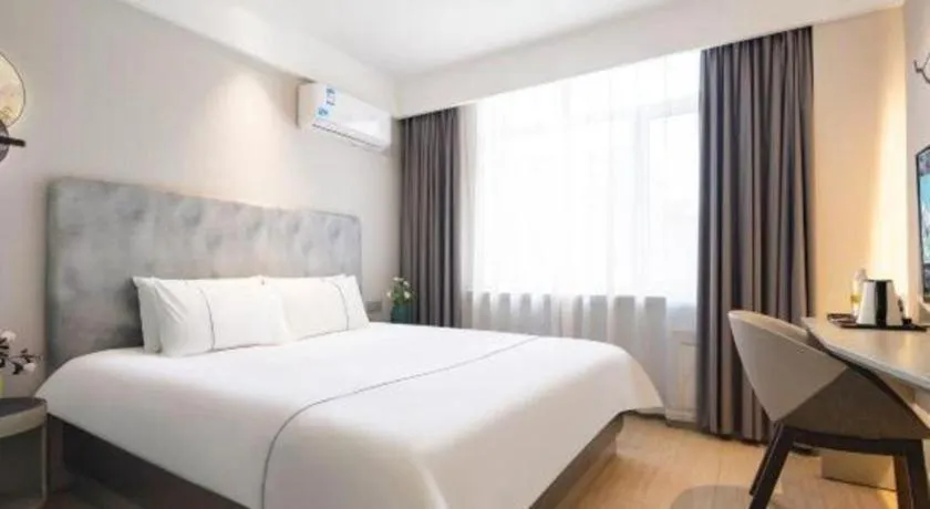 Bed in Magnotel Hotel Dandong Railway Yalv River