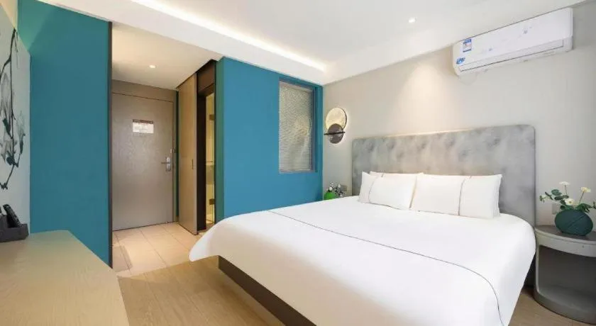 Bed in Magnotel Hotel Dandong Railway Yalv River