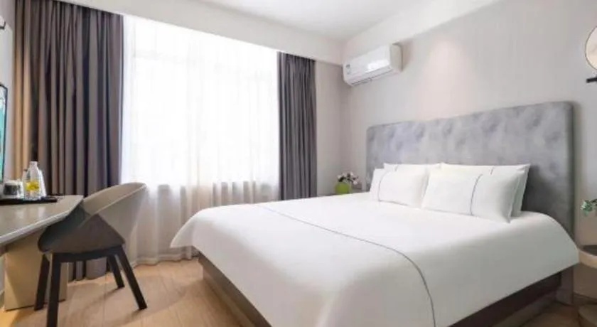 Bed in Magnotel Hotel Dandong Railway Yalv River