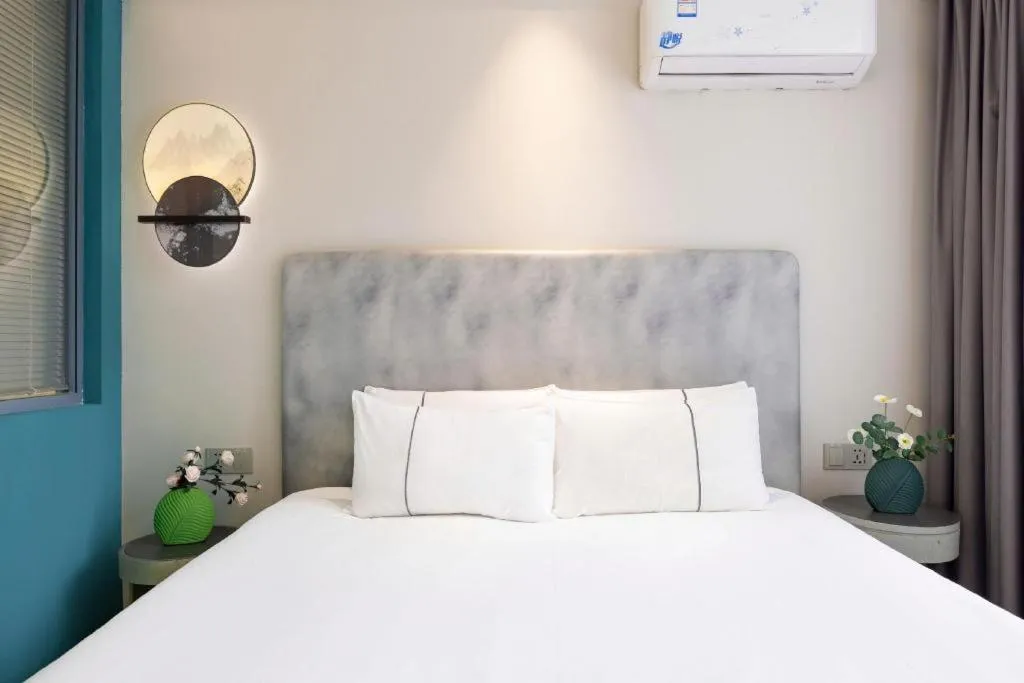 Bed in Magnotel Hotel Dandong Railway Yalv River