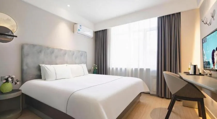 Bed in Magnotel Hotel Dandong Railway Yalv River