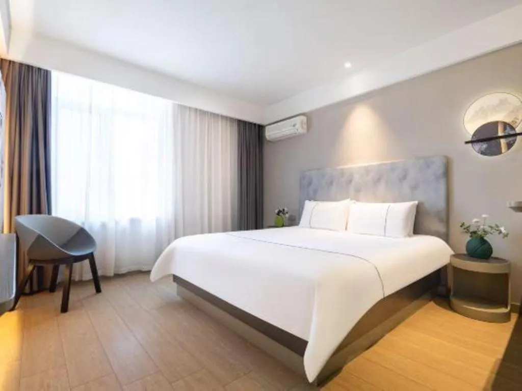 Bed in Magnotel Hotel Dandong Railway Yalv River