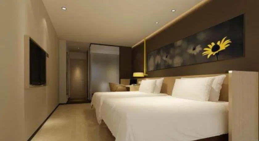 Bed in IU Hotel·Tianjin Binhai New District Yanghuo Market