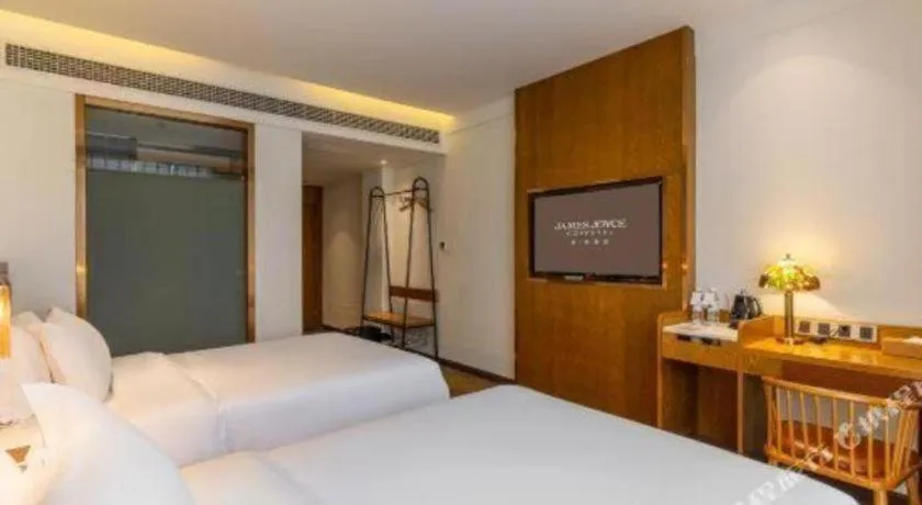 Bed in James Joyce Coffetel·Chadianzi Passenger Terminal Jinke Bei Road Metro Station