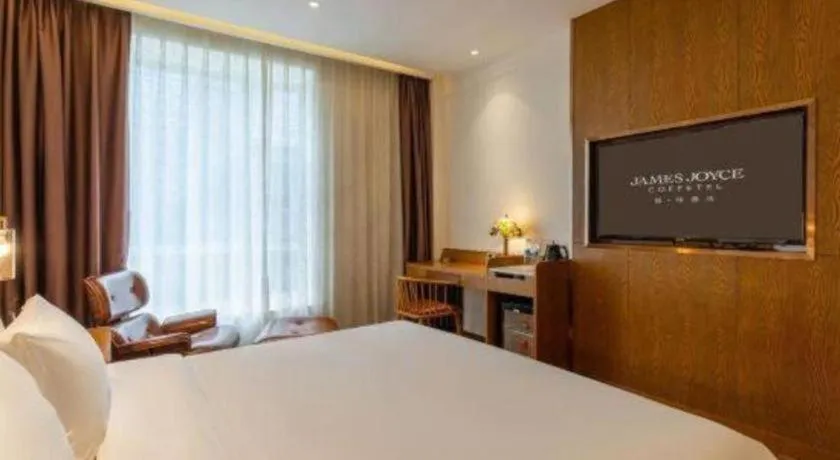 Bed in James Joyce Coffetel·Chadianzi Passenger Terminal Jinke Bei Road Metro Station