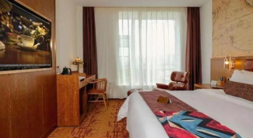 Bed in James Joyce Coffetel·Chadianzi Passenger Terminal Jinke Bei Road Metro Station