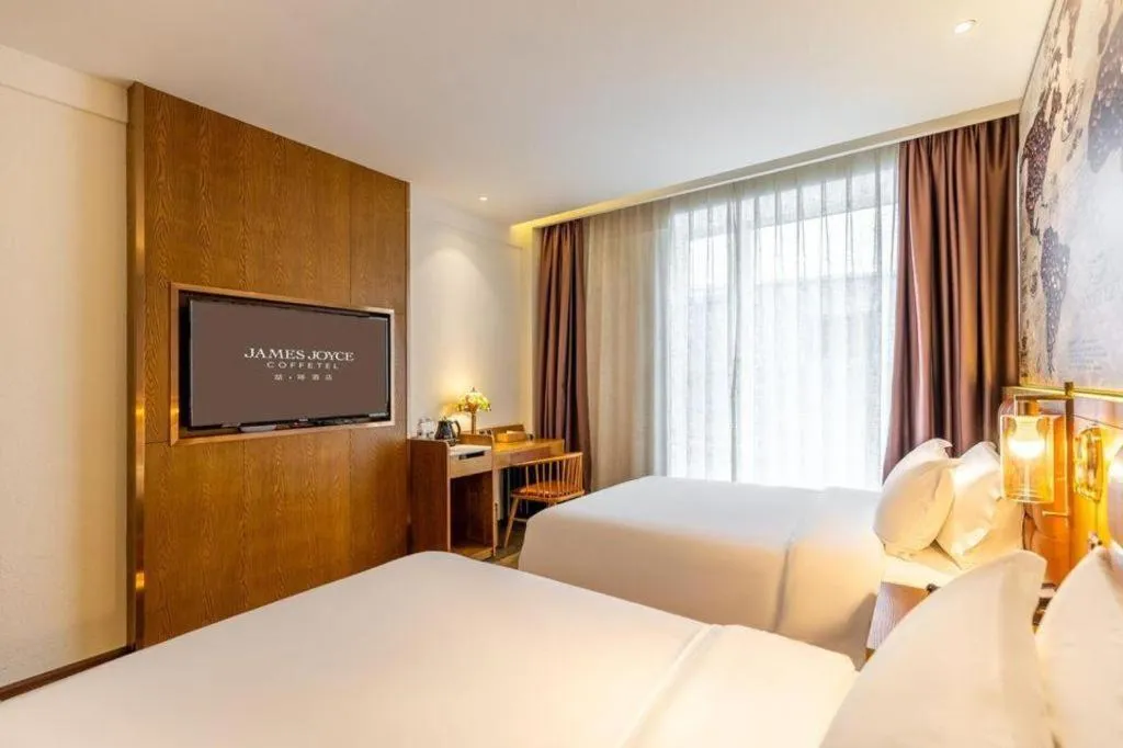 Bed in James Joyce Coffetel·Chadianzi Passenger Terminal Jinke Bei Road Metro Station