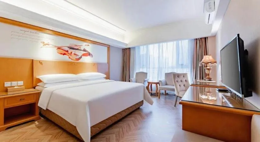 Bed in Vienna Hotel Inner Mongolia Hohhot Railway Station Gongzhufu Metro Station