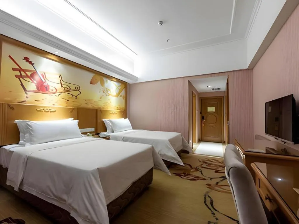 Bed in Vienna Hotel Inner Mongolia Hohhot Railway Station Gongzhufu Metro Station