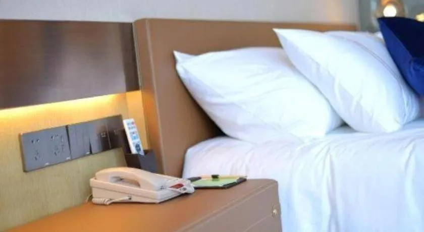 Bed in AUGUSTINE HOTEL