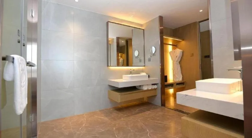 Bed in AUGUSTINE HOTEL