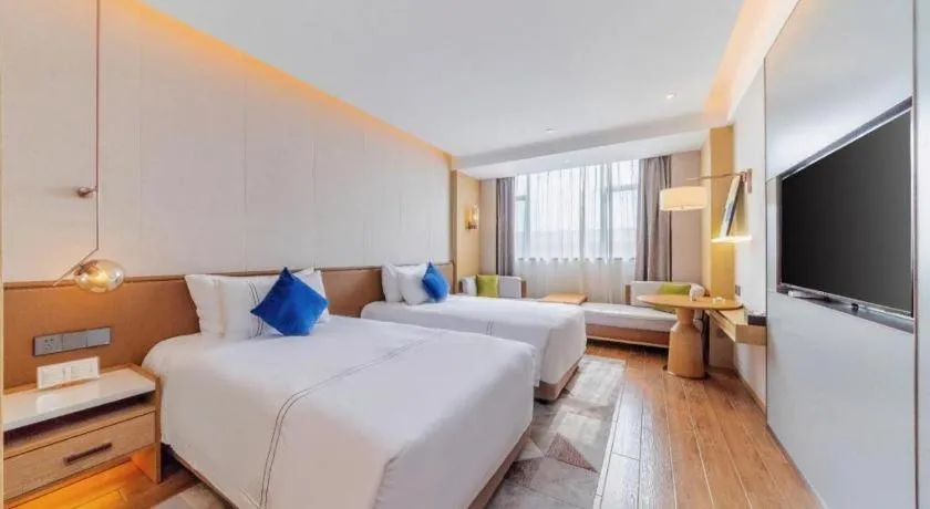 Bed in AUGUSTINE HOTEL