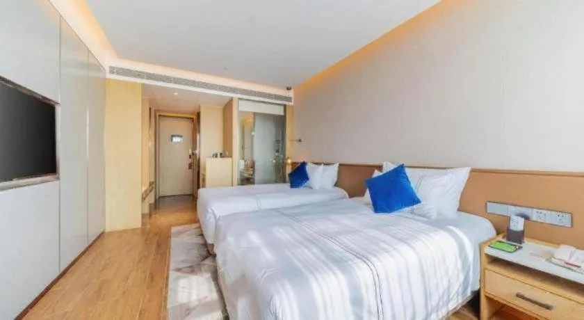 Bed in AUGUSTINE HOTEL