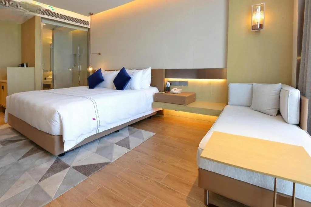 Bed in AUGUSTINE HOTEL