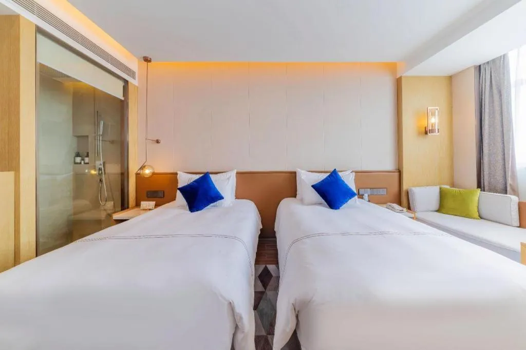 Bed in AUGUSTINE HOTEL