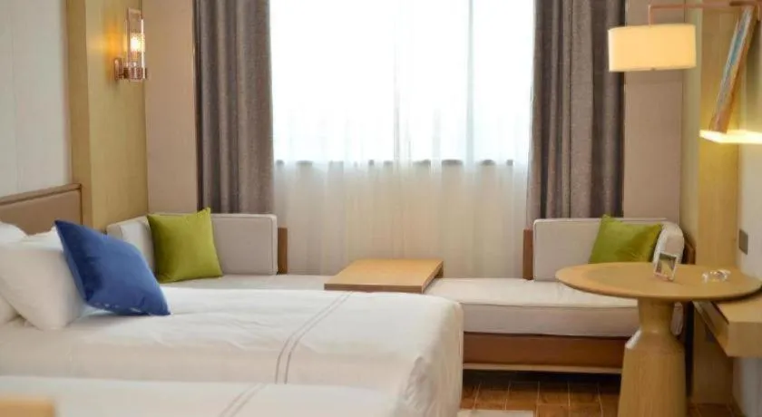 Bed in AUGUSTINE HOTEL