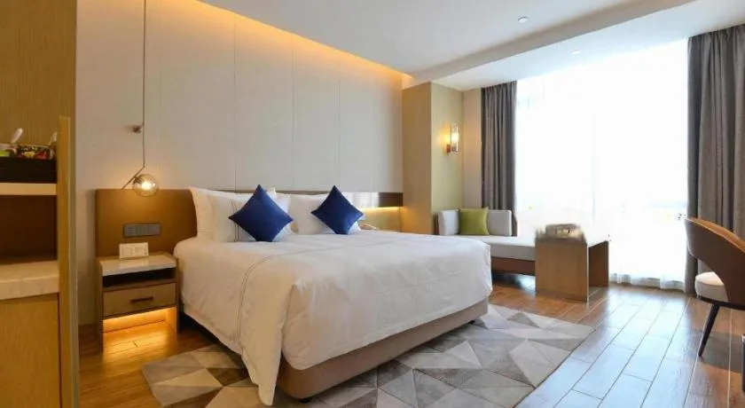 Bed in AUGUSTINE HOTEL