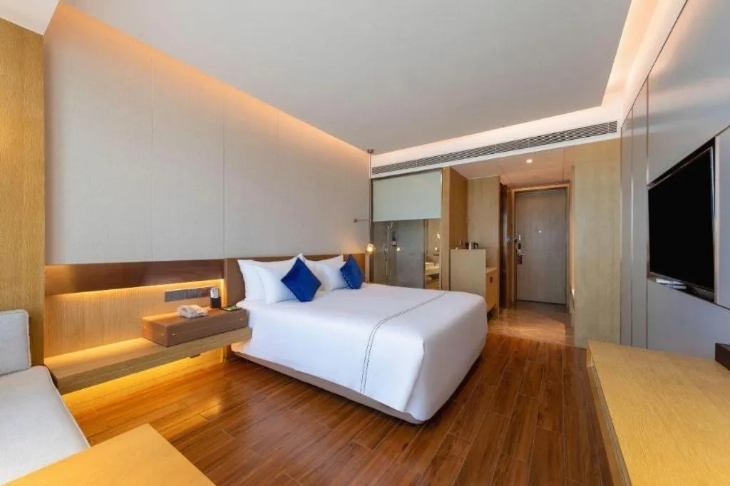 Bed in AUGUSTINE HOTEL