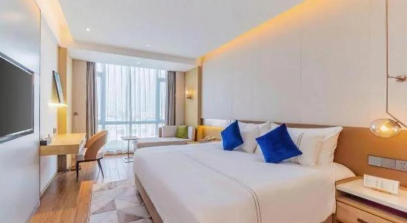 Bed in AUGUSTINE HOTEL