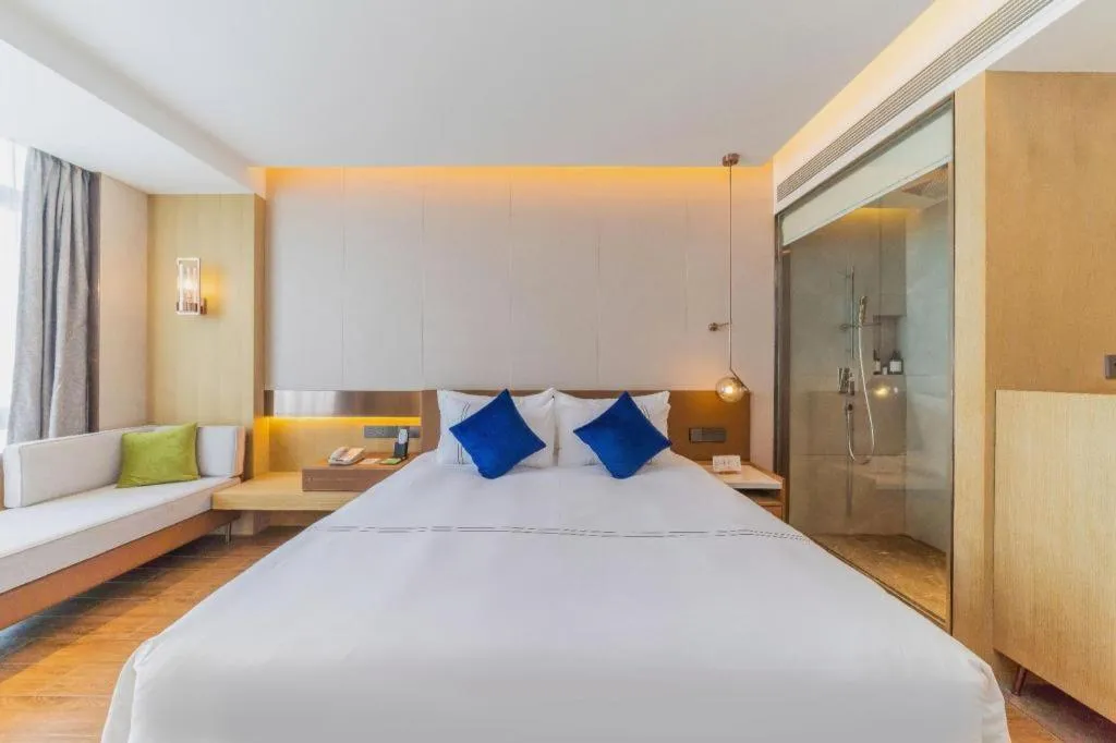 Bed in AUGUSTINE HOTEL