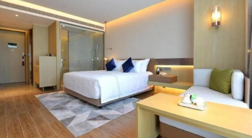 Bed in AUGUSTINE HOTEL