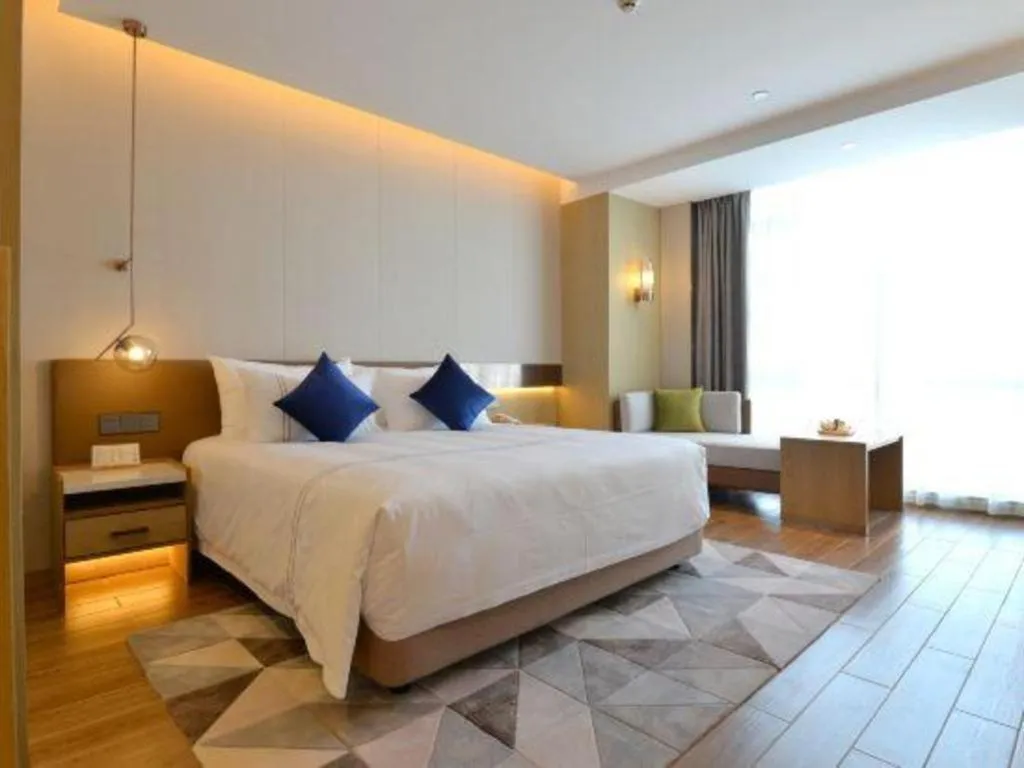 Bed in AUGUSTINE HOTEL