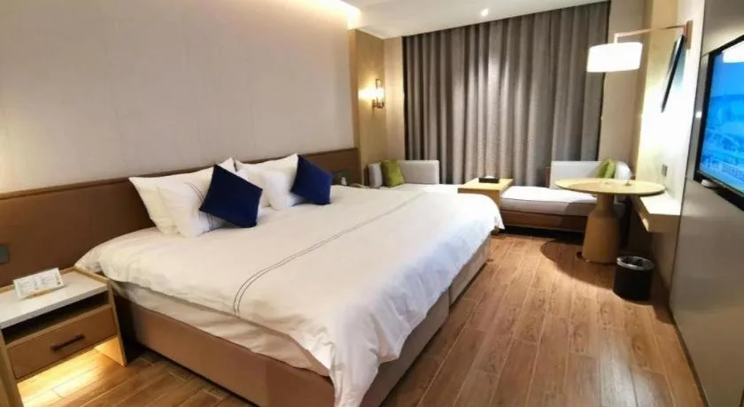 Bed in AUGUSTINE HOTEL