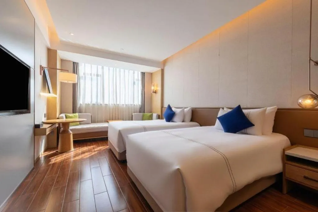 Bed in AUGUSTINE HOTEL