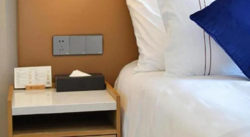 Bed in AUGUSTINE HOTEL