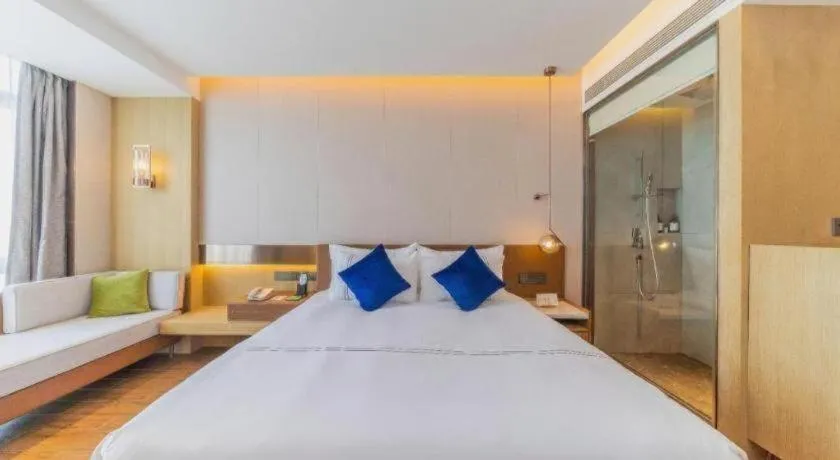 Bed in AUGUSTINE HOTEL