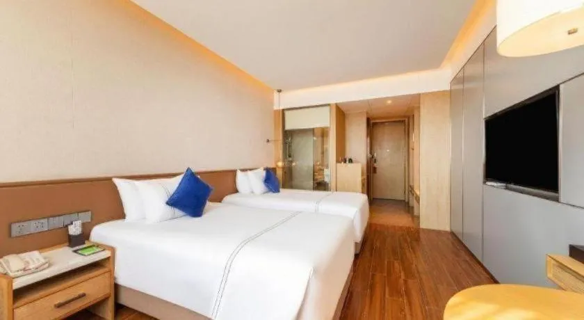 Bed in AUGUSTINE HOTEL