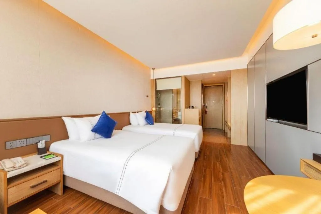 Bed in AUGUSTINE HOTEL